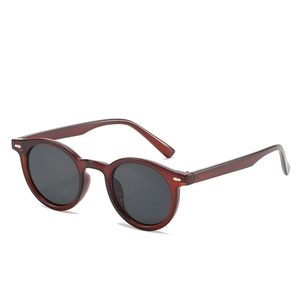 Retro tortoise round frame sunglasses with grey lenses and silver stud accents