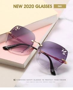 Close-up of frameless gradient purple lenses with butterfly hollow design and tiny rhinestones