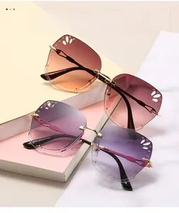 Detail of rimless square sunglasses with hollow pattern and rhinestones on lenses
