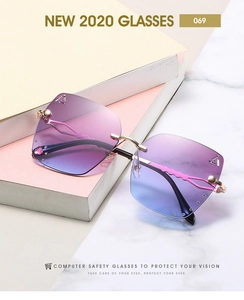 Detail of rimless square sunglasses with rhinestone accents and purple-blue gradient lenses