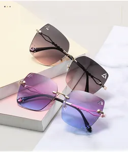 Detail of rimless gradient sunglasses with heart crystals and gold zigzag temples
