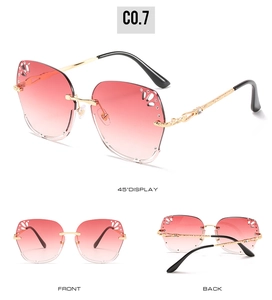 Three-view display of rimless gradient sunglasses with carved gold metal temples