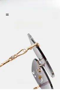 Detailed view of gold baroque temples with crystal inlay on rimless gradient sunglasses