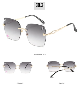 Detailed views showing grey gradient lenses with silver studs and gold chain-link temples