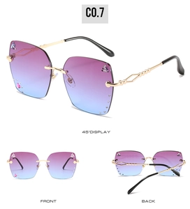 Three-way view of purple gradient rimless sunglasses with rhinestone accents and gold frames