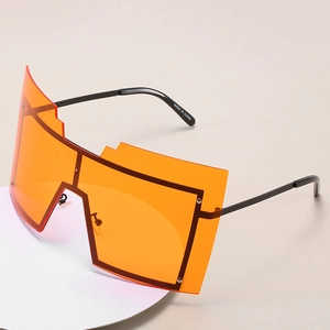 Lunettes de soleil géométriques surdimensionnées avec verres orange vifs