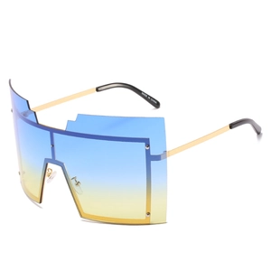 Lunettes de soleil carrées oversize avec verres dégradés bleu-jaune et branches dorées