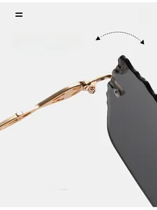 Detail of durable textured golden metal hinge on rimless sunglasses with wave-cut lenses