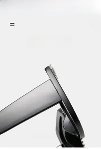Macro detail of black square sunglasses featuring sparkling silver rhinestones along the frame