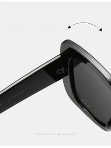 Macro view of durable texture hinge on black square oversized UV400 sunglasses
