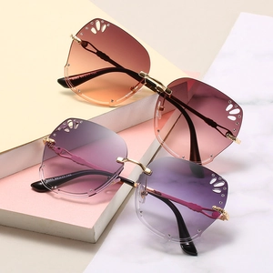 Rimless gradient butterfly sunglasses with gold frames and cutout diamond accents