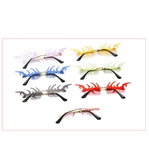 Flame shaped rimless sunglasses in seven colors with sleek metal frames and nose pads