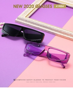 Detail view of square rhinestone sunglasses in black and purple with thick temple design