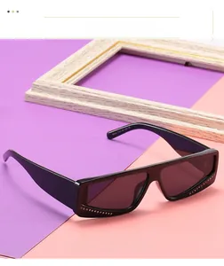 Macro detail of square rhinestone sunglasses with black frames and sparkling accents