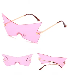 Three-angle view of pink rimless oversized cat-eye sunglasses with lightning edge lenses