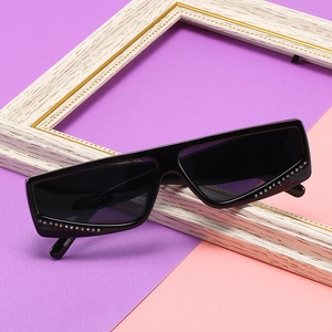 Fashionable square sunglasses with diamond-encrusted frames and dark gray lenses