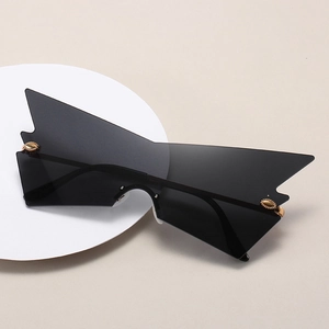 Oversized cat-eye sunglasses with irregular geometric frames and gold hardware details