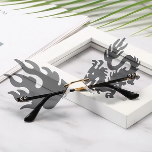 Creative dragon and flame shaped rimless sunglasses with gold metal frame and dark lenses