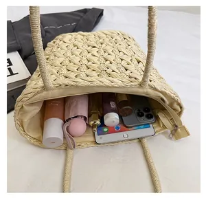 Detailed top view of large capacity straw woven beach tote bag with zipper and inner lining