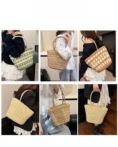 Detail showing various colors of hand-woven straw bags with rope handles for beach vacation