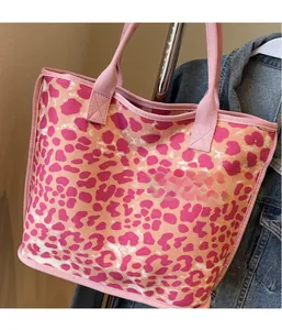 Close-up of pink leopard print canvas tote bag with reinforced handles and sturdy seams