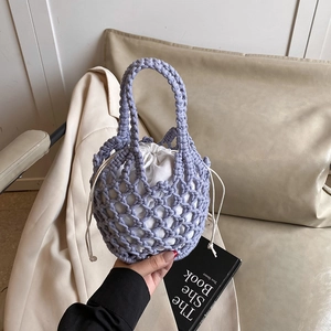 Handmade purple hollow knit tote bag with white drawstring liner for summer beach vacation