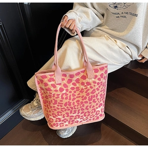 Detail shot of pink leopard print canvas tote bag with sturdy fabric handles