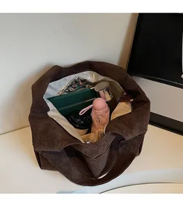 Spacious interior of brown corduroy tote bag showing large capacity for daily items