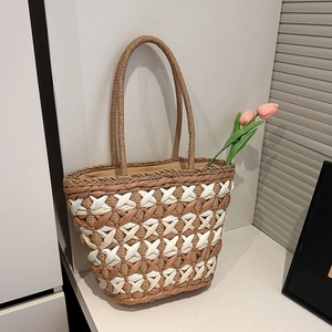 Handwoven straw tote bag with brown diamond grid pattern for summer beach vacations