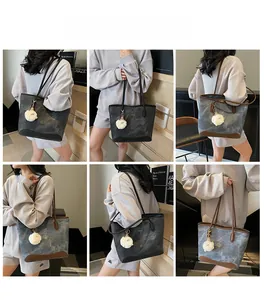 Fashion tote bag with marble pattern, leather details and plush sheep pendant shown on model