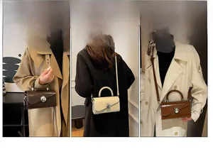 Chic box crossbody bag detail showing three versatile carrying styles and ball clasp