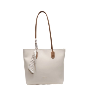 Minimalist off-white faux leather tote bag with brown handles and a patterned silk scarf