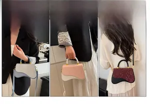 Detailed view of fashionable box bags with unique curved bottom in three various colors