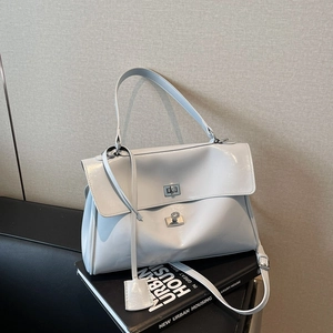 Chic white patent leather tote bag with silver lock and adjustable strap for women