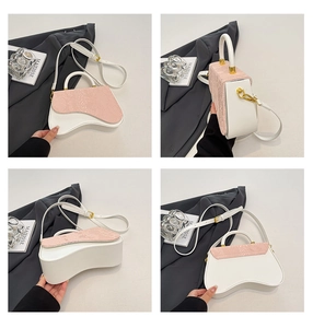 Detail shots of a white leather box bag with pink snakeskin flap and wavy design
