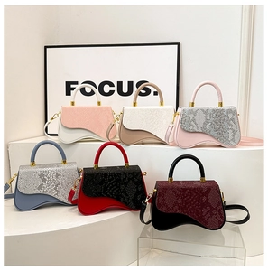 Detailed display of fashionable contrast color box bags in six vibrant color variations