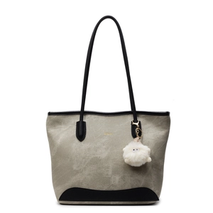 Gray-green canvas tote bag with black leather trim and cute white sheep plush charm