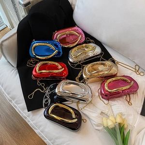 Detailed collection of colorful metallic shell evening bags with elegant gold ring handles