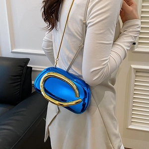 Metallic electric blue clutch bag with large oval gold hardware and chain strap details