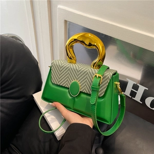 Green box crossbody bag with gold handle and knit patchwork detail for women