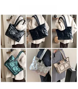 Quilted down tote bag colors including black, green, silver, and gold on models