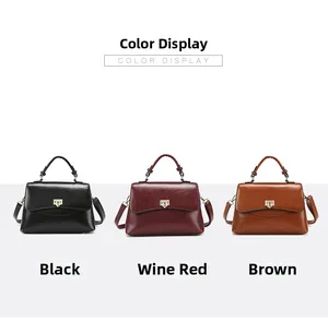 Drei elegante Handtaschen in Schwarz, Burgund und Braun mit goldenen Drehverschlüssen