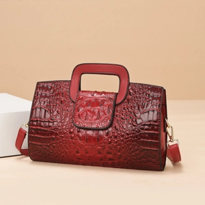 Elegant red crocodile pattern tote bag with gold hardware and removable shoulder strap