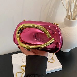 Glossy purple evening clutch with gold U-shaped handle and detachable chain strap
