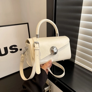 Elegant off-white faux leather box bag with silver metal buckle and adjustable strap