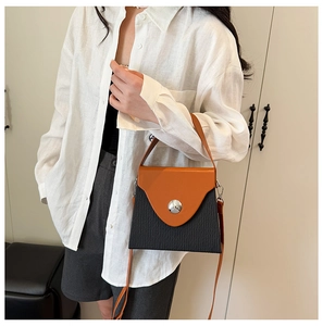 Fashionable contrast color box bag with orange flap and pleated black body for women