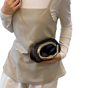Elegant purple glossy hardshell clutch bag with large golden C-ring and chain strap