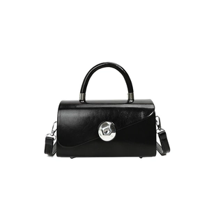 Modern black glossy square handbag with a silver metal ball clasp and top handle
