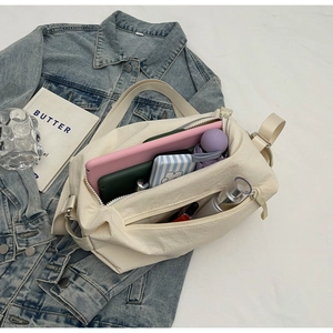 Top view of large canvas tote bag showing interior storage for tablet and umbrella