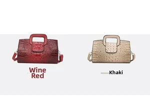 Detail view of rectangular tote bags in wine red and khaki with croc texture